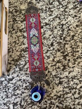 Red Patterned Ribbon Wall Hanging with Blue Evil Eye Charm